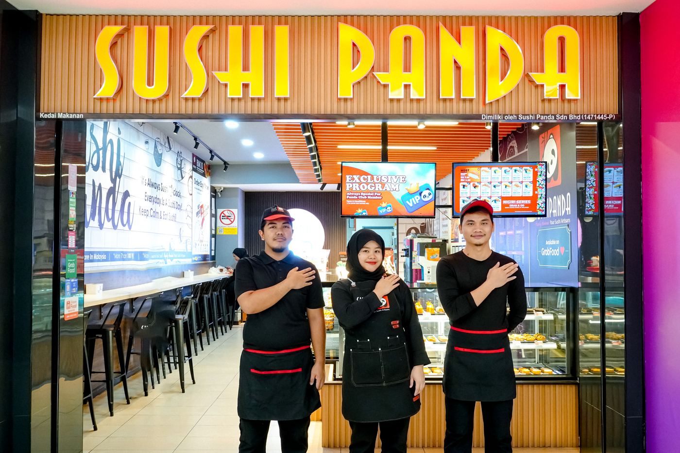 Customers choosing at the Sushi Panda counter in Suria Sabah Mall, Kota Kinabalu